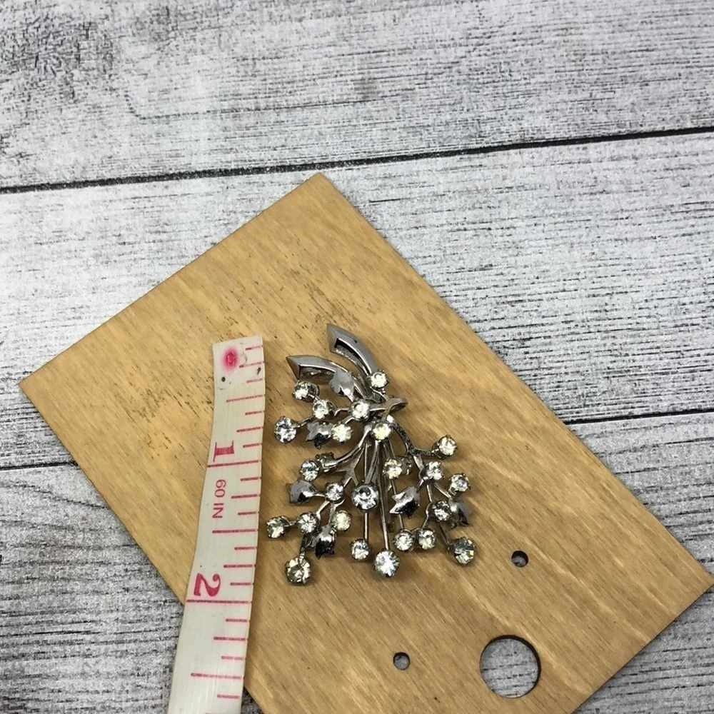 Vintage rhinestone flower branch statement glam brooch.